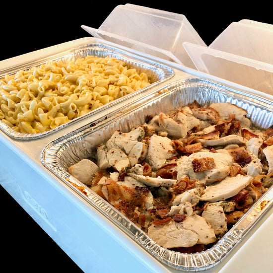 The Dubler HEAT is unique innovation as a flameless chafer and cooler combination that fits two 1/2 size food pans and up to 4” depth.  The premium insulation, along with the heat packs and placing hot food trays straight from oven, provide a slow drop in temperature over time.  Enjoy hot to eventually warm food for hours while the outside remains safe to touch for easy mobility.